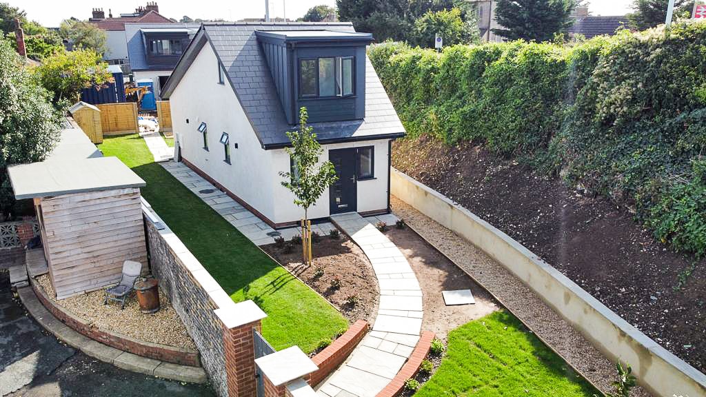 Natural Stone Patio in East Worthing : Natural stone wrap around patio and foot path