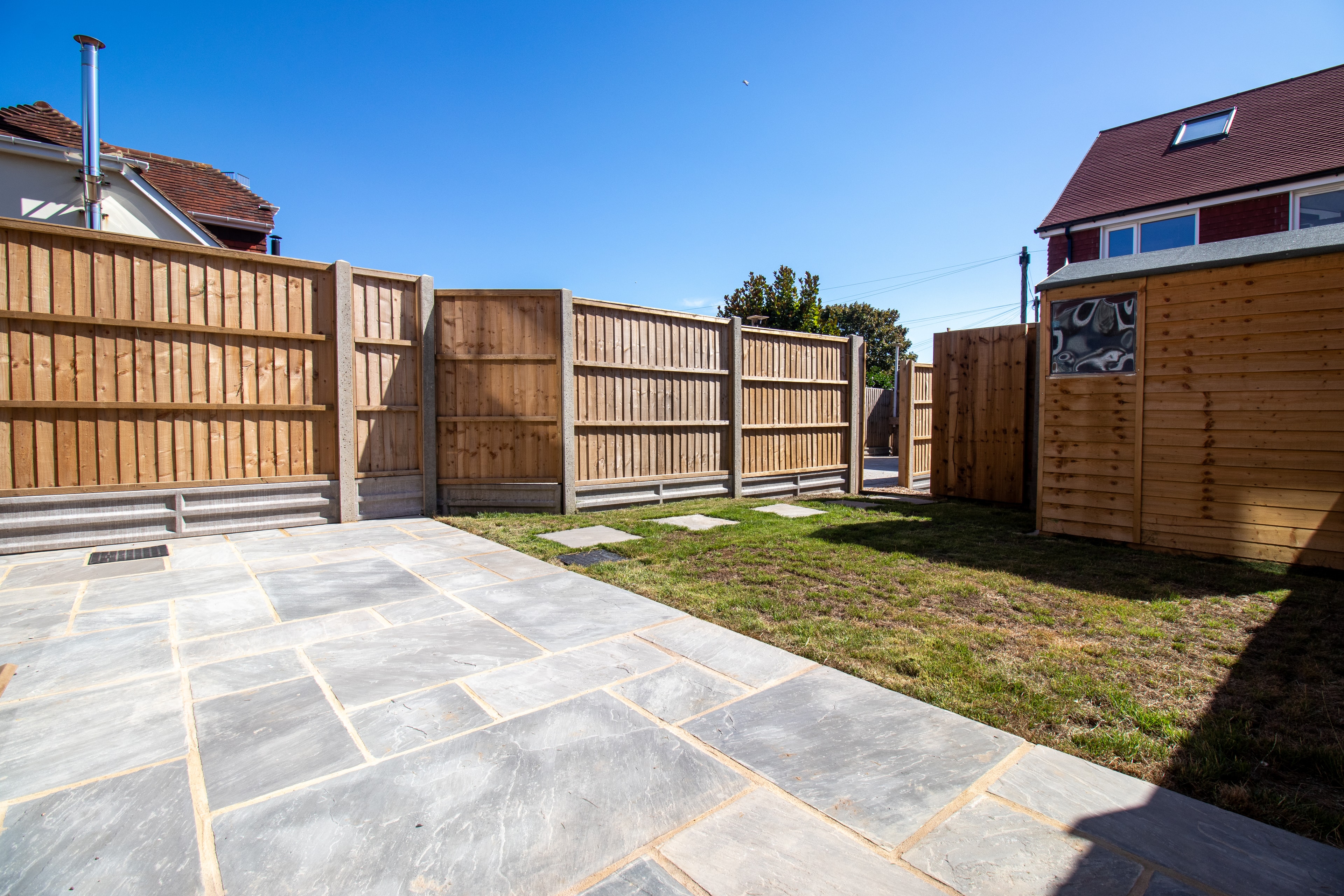 Indian sandstone patio in Shroreham : Indian sand stone patio and new boundary fence